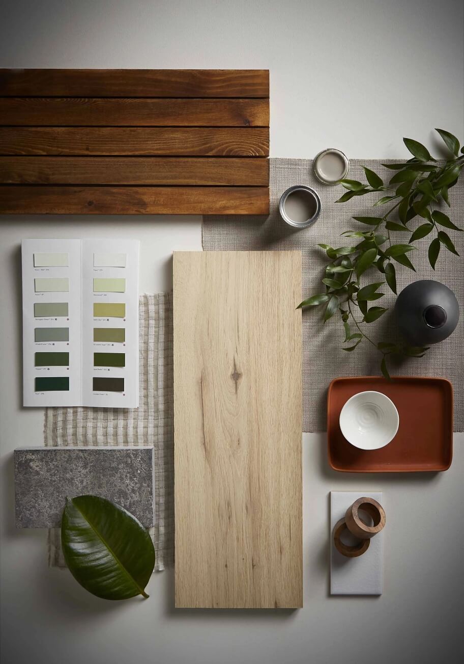 A desktop featuring samples of various flooring materials and colour schemes