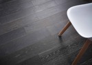 A stylish chair on dark wooden flooring