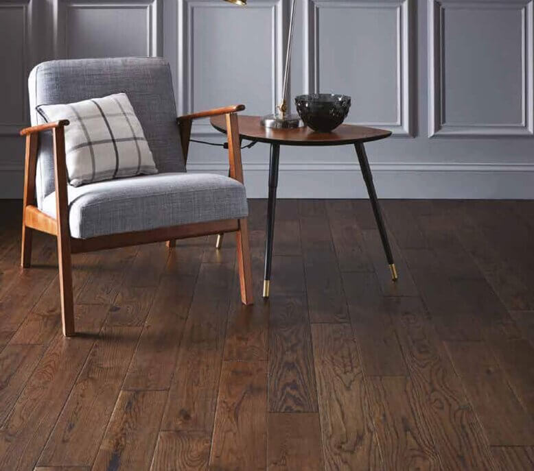 A chair and table on a wooden floor.